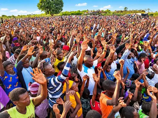 Hands raised across the crusade ground