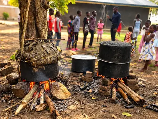 Cooking for the houses over an open fire